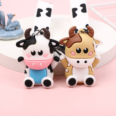 Un buen precio. Cadena de llaves de caricatura de vaca de silicona para mochila y colgante de automóvil para damas en línea